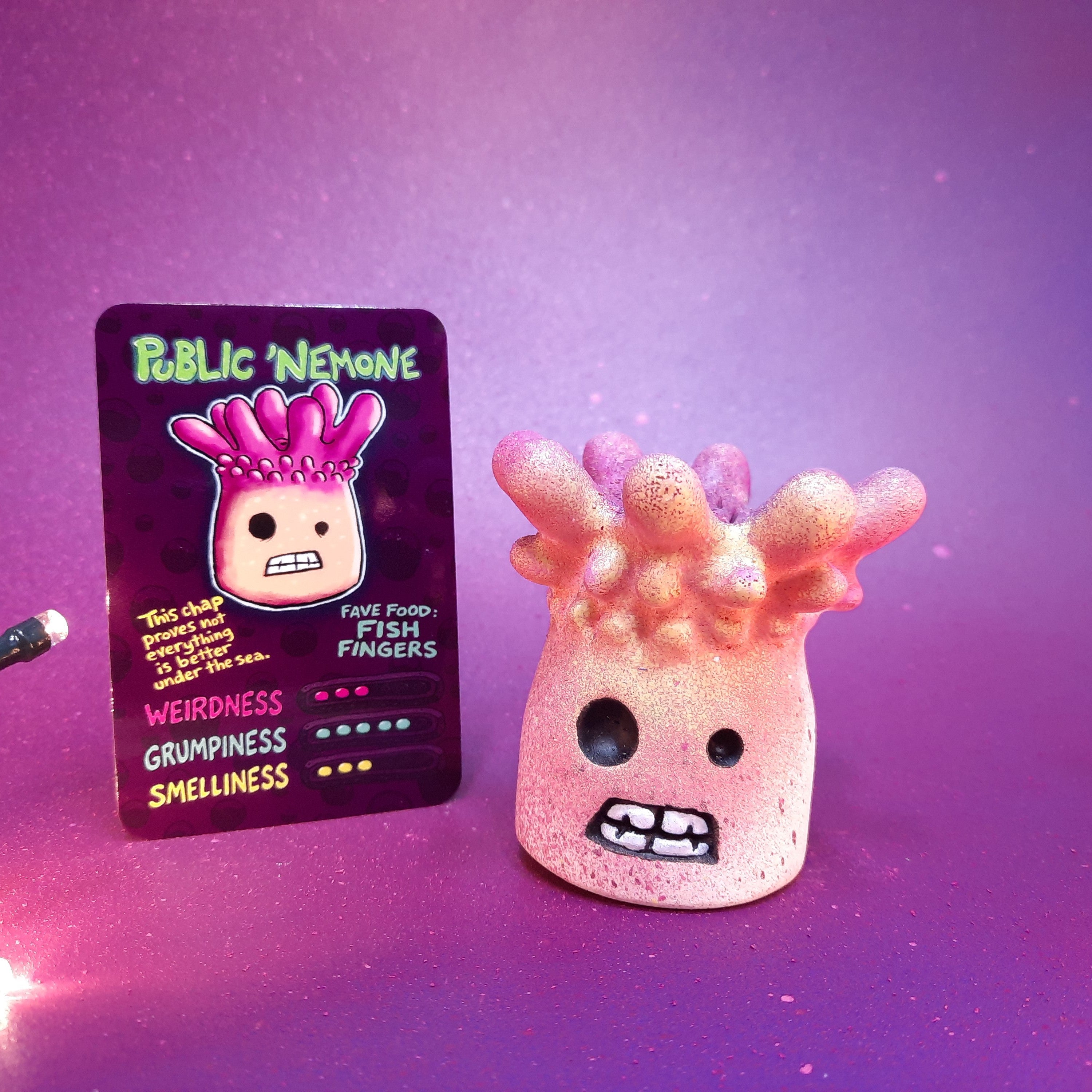 Public Nemone sea-anemone-inspired Flobbazoid figurine with soft coral fronds and specimen card.